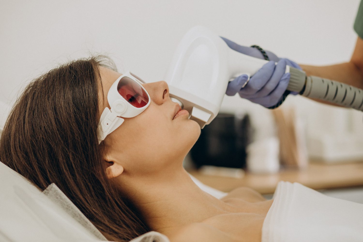 Esthetician performing painless diode laser hair removal treatment at H-Bling Wellness in Brea, CA
