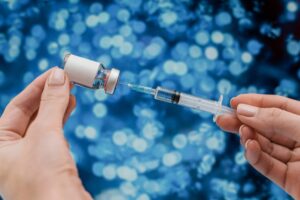 Licensed wellness professional administering peptide injection therapy at H-Bling Wellness in Brea, CA